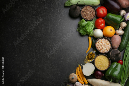 Fresh vegetables on gray background, top view