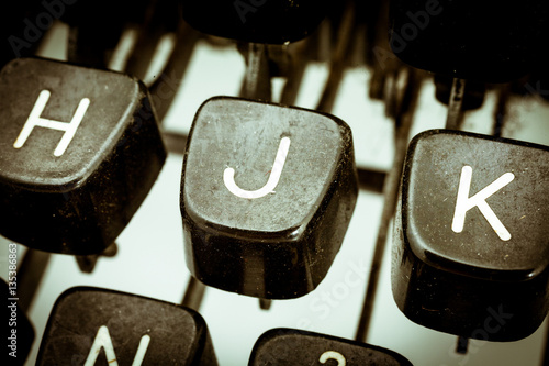 Fotografie J letter on a vintage typewriter keyboard