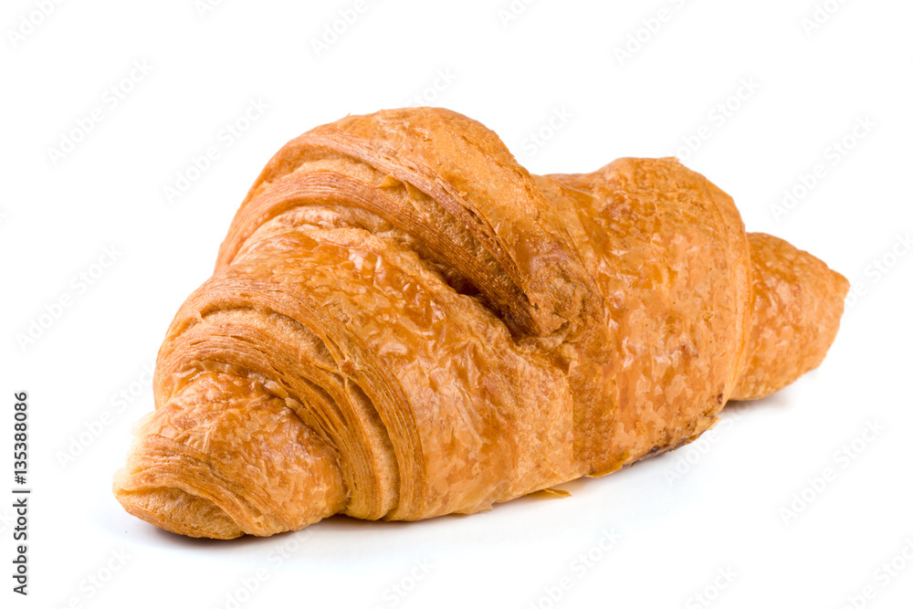 one croissant isolated over a white background closeup