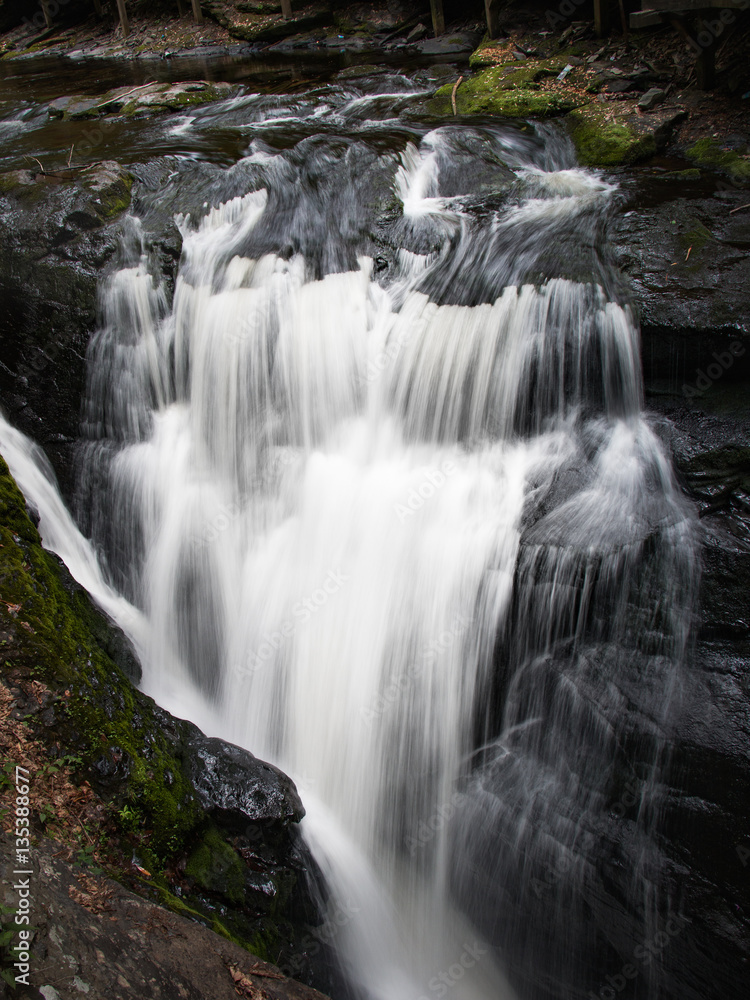 Small waterfall at the base of Bushkill Falls in the Poconos, Pennsylvania Small waterfall at the base of Bushkill Falls in the Poconos, Pennsylvania