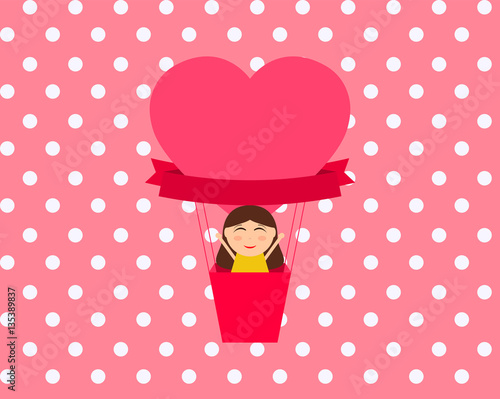 Girl sitting in hot air balloon in the shape of heart