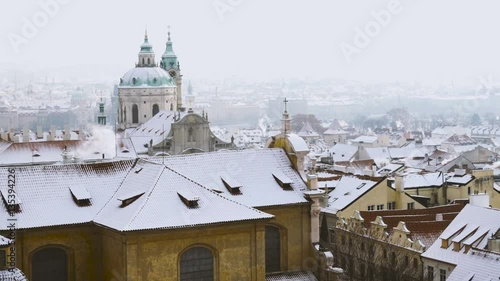 View of Prague City Rooftops, Buildings and Monuments Under the Snow in Winter
 photo