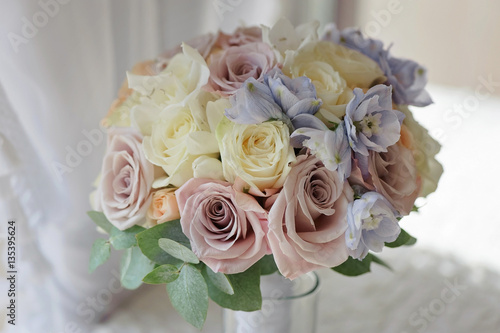 Bridal bouquet of blue delphinium roses close