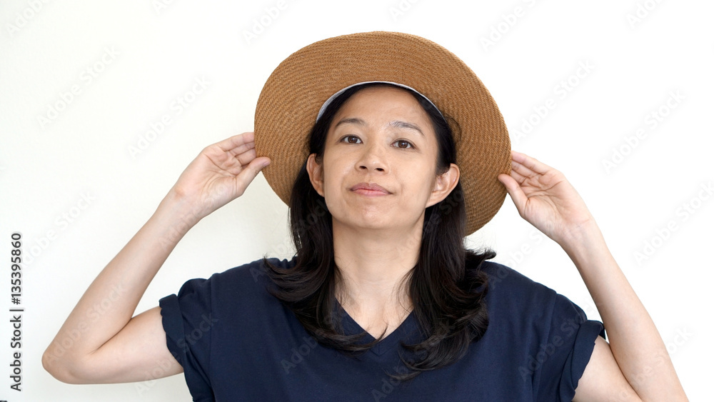 Asian girl wearing hat and casual shirt, smile and happy on whit Asian girl wearing hat and casual shirt, smile and happy on whit