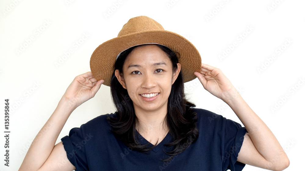 Asian girl wearing casual hat, smile and happy on white backgrou Asian girl wearing casual hat, smile and happy on white backgrou
