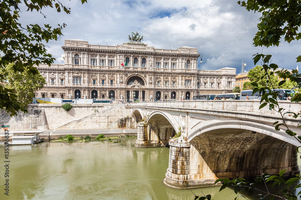 Sunny view of Supreme Cassation court with bridge over Tiber river in Rome, Lazio region, Italy.