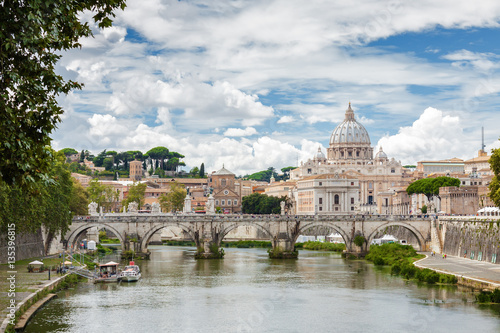 Cloudy view at Tiber and Basilica di San Pietro with bridge in Vatican, Rome, Lazio region, Italy.