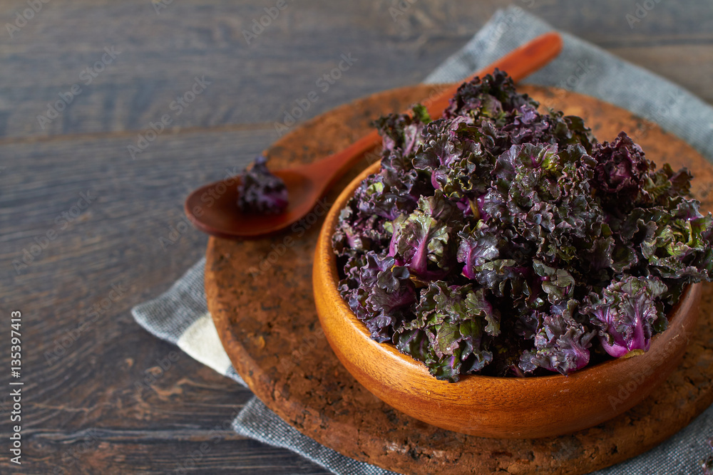 Bunch of fresh kale sprouts on wooden background Bunch of fresh kale sprouts on wooden background