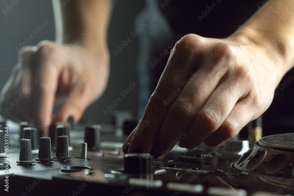 DJ playing music at mixer closeup DJ playing music at mixer closeup