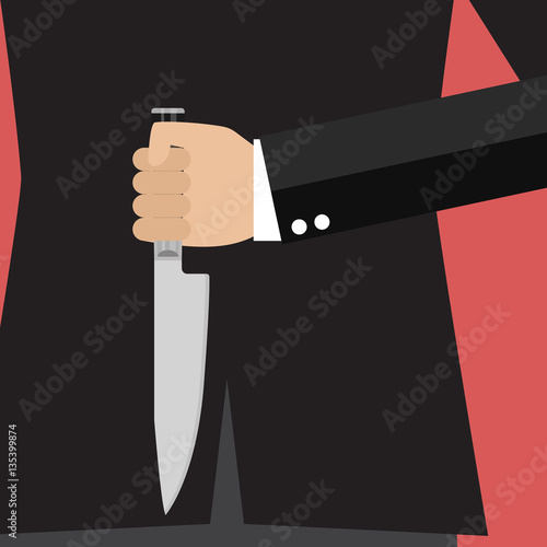 Businessman holding a knife behind his back