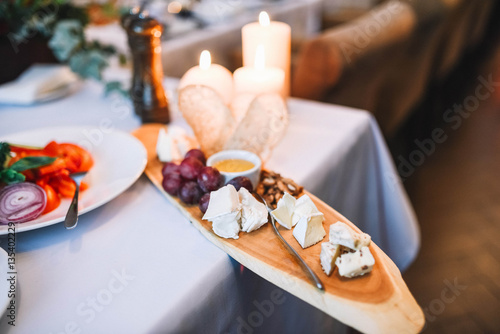delicious cheese snacks lying on wooden board