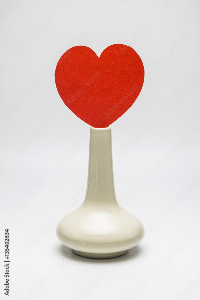 Paper shaped as hearts on vase, valentine's day.