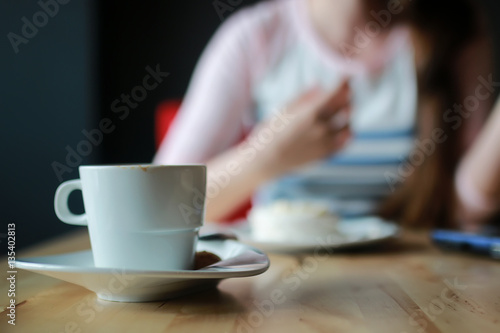 girl in a cafe for a cup of coffee with the notebook