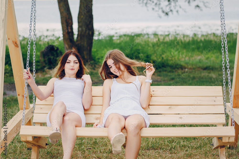two girls resting on the beach two girls resting on the beach