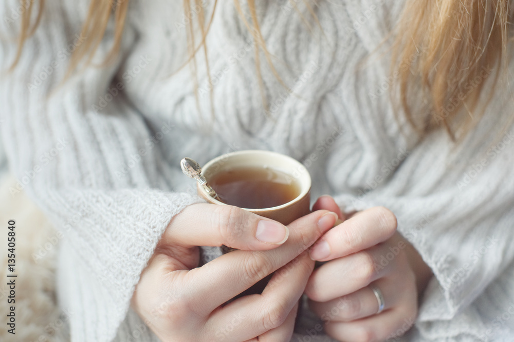 girl heats hands about cup of tea girl heats hands about cup of tea