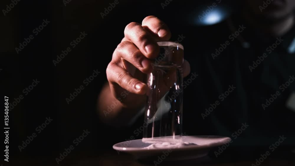 Pouring a scotch whiskey on the rocks Pouring a scotch whiskey on the rocks