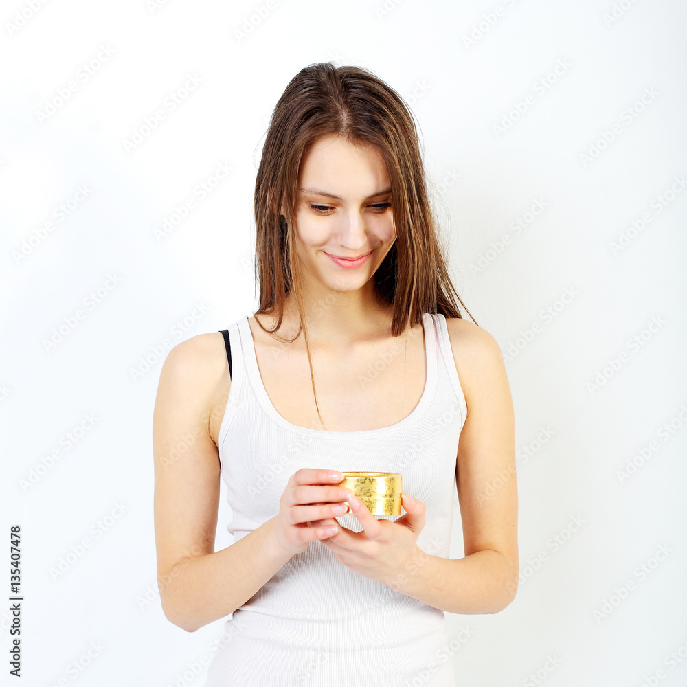 Positive hipster girl in a t-shirt and gift. The woman received a gift. Positive hipster girl in a t-shirt and gift. The woman received a gift.