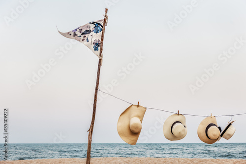Hanging Peg Woven Hats Flag Pole Sea Shore Concept