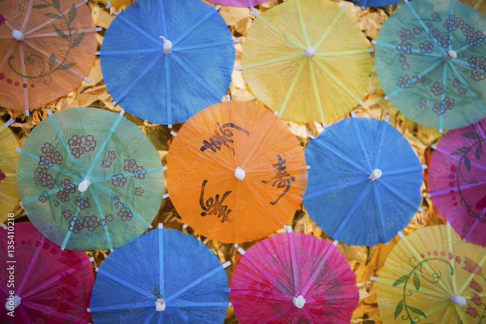 Summer concept idea, colorful paper umbrella background