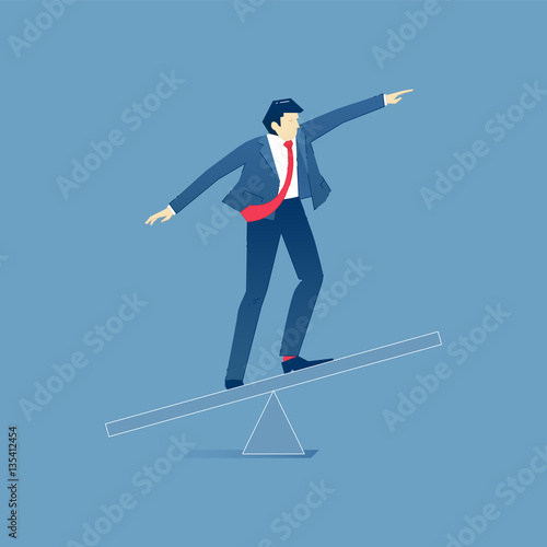 Businessman balancing on a seesaw