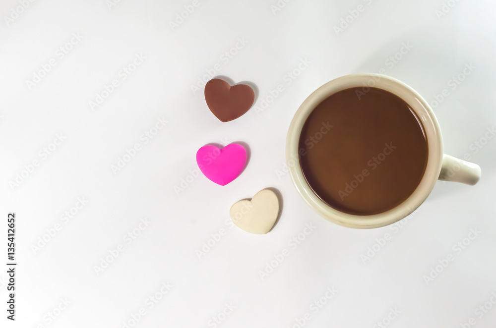 coffee cup and chocolate heart-shaped coffee cup and chocolate heart-shaped