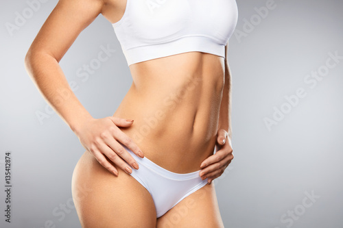 Fototapeta Naklejka Na Ścianę i Meble -  Woman Slim Body. Сloseup Of Beautiful Female In Shape In Bikini