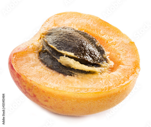 Ripe apricot's cross section with apricot seed in it. Clipping p photo