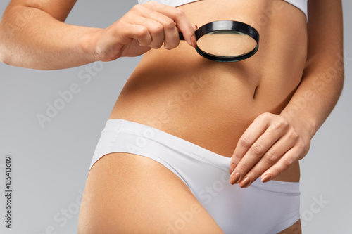 Female Health. Сloseup Of Woman In Bikini Exploring Her Body