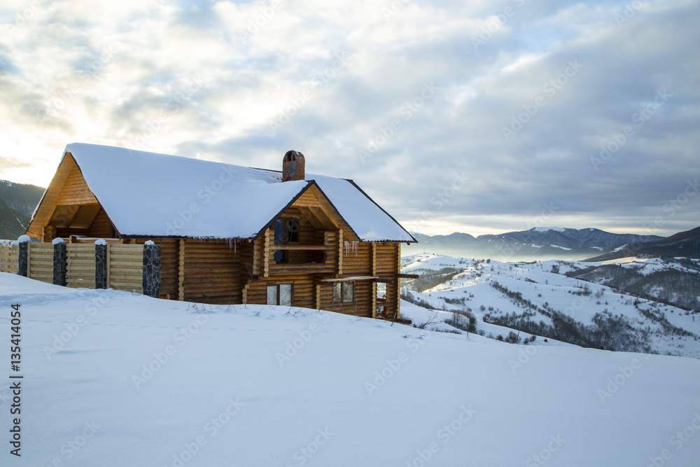 Wooden Home in the mountains. Winter Carpathian mountains Wooden Home in the mountains. Winter Carpathian mountains