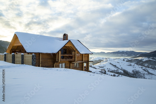 Wooden Home in the mountains. Winter Carpathian mountains 