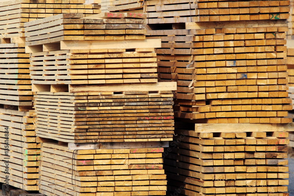stock of wood planks on the factory yard