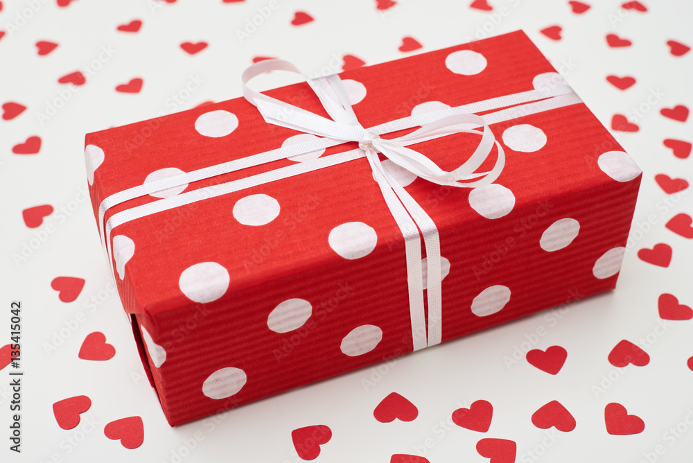 Side view of dotted gift box with white ribbon Side view of dotted gift box with white ribbon