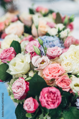 Bouquet of pink and beige roses and with blue hydrangea