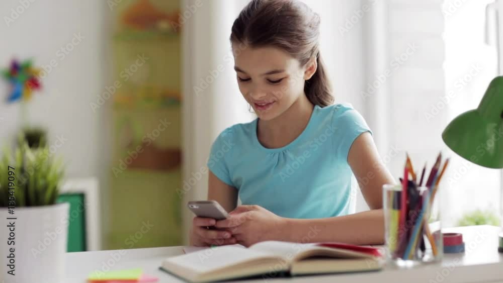 girl with smartphone distracting from homework girl with smartphone distracting from homework