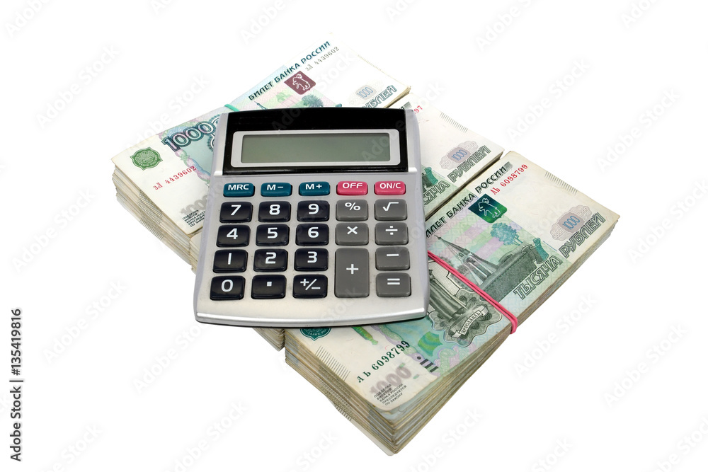 The calculator lies on packs of thousand-ruble Russian notes, is The calculator lies on packs of thousand-ruble Russian notes, is