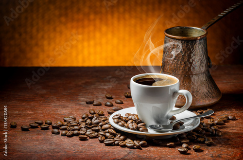 Coffee cup and saucer on a wooden table
