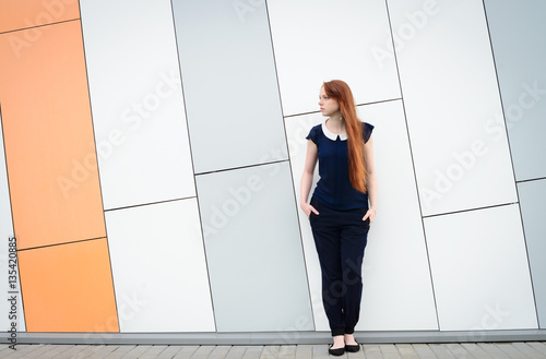 redhair woman with freckles outside office break