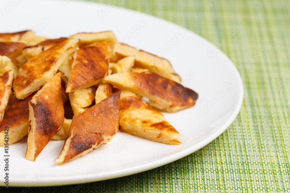 Home made Kaiserschmarrn on white plate, closeup, low focus Home made Kaiserschmarrn on white plate, closeup, low focus