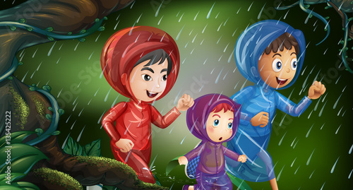 Three kids running in the rain