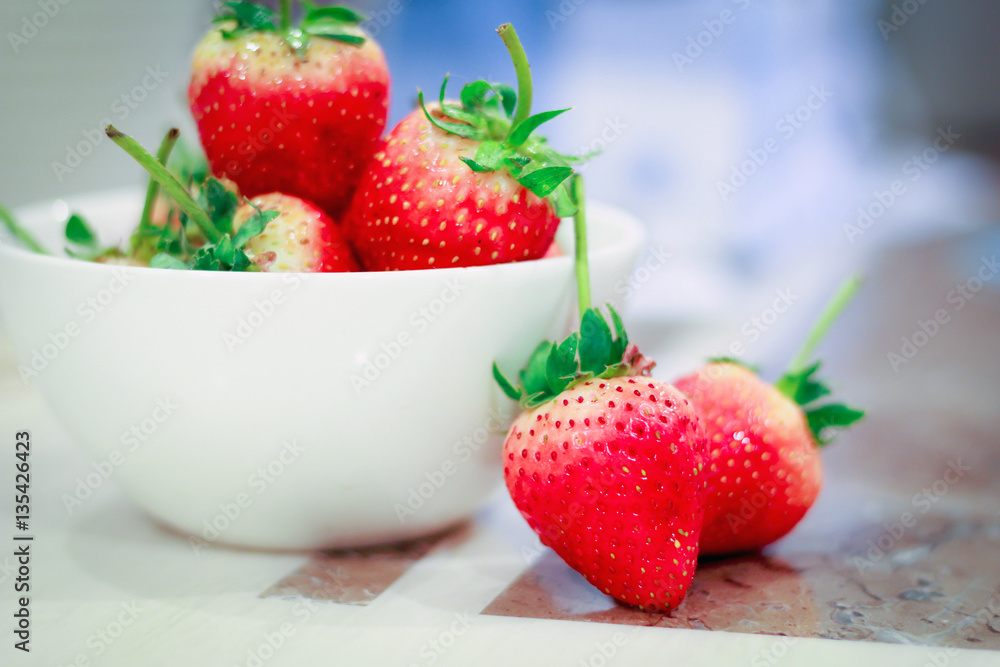 Fresh strawberries in a bowl on table. Fresh strawberries in a bowl on table.