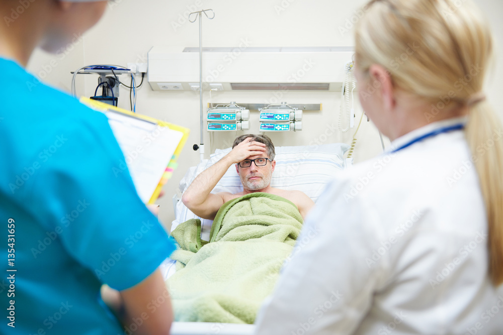 Doctors telling patient the diagnosis Doctors telling patient the diagnosis