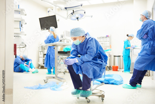 Fotografie Operating room full of tired surgeons