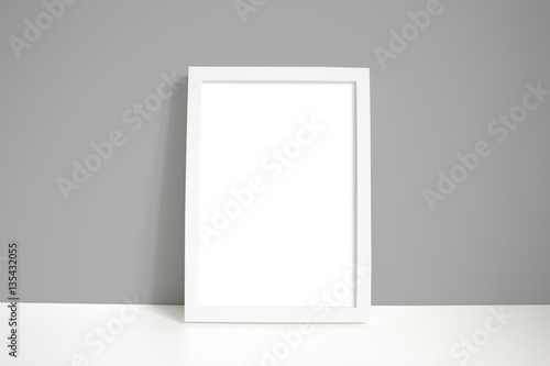 A4 white portrait frame with grey wall