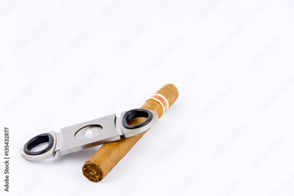 Object photography of a cigar and a cutter Object photography of a cigar and a cutter