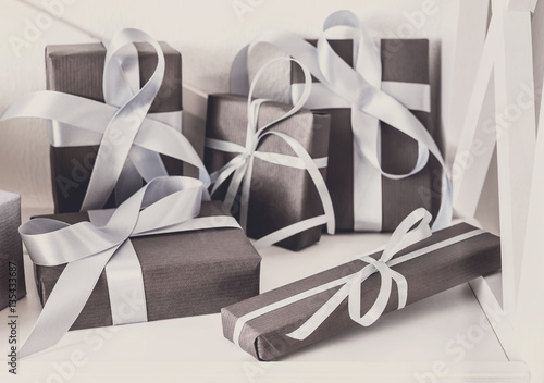 Tableau sur toile Elegant presents, gift boxes on white shelves background, closeup