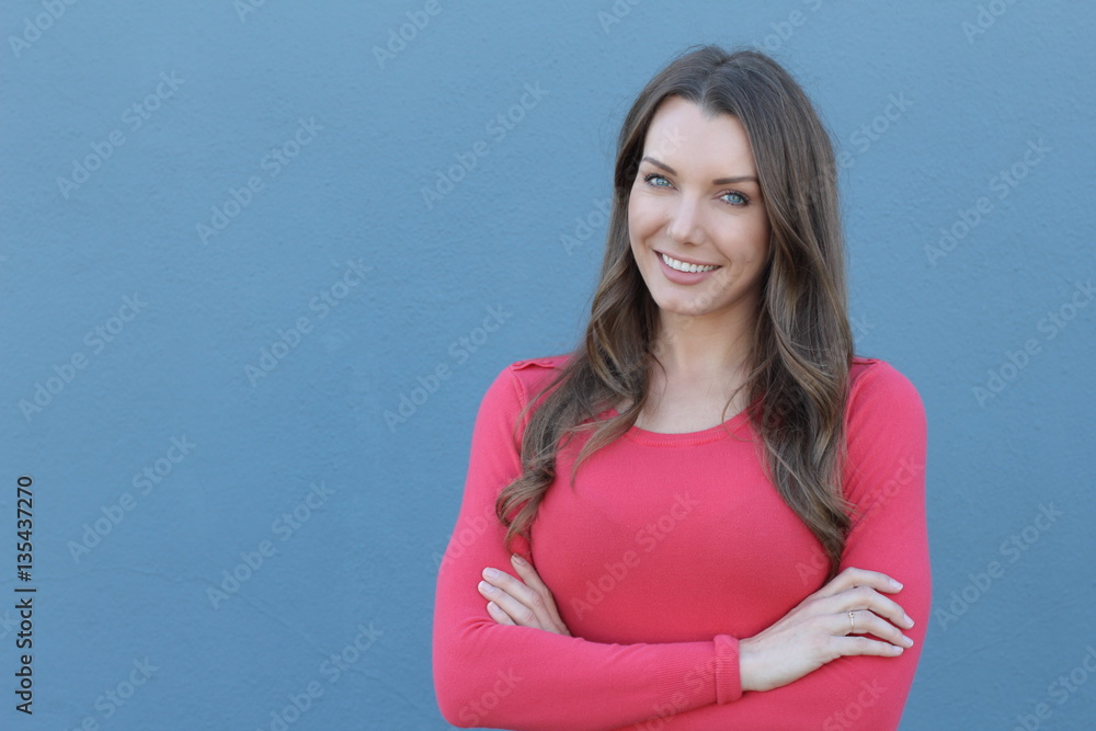 Beautiful young woman smiling with arms crossed Beautiful young woman smiling with arms crossed
