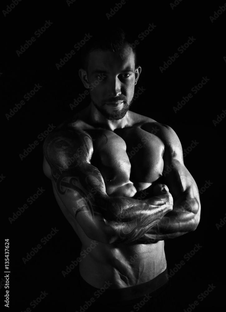 Fototapeta premium Strong athletic man showes naked muscular body