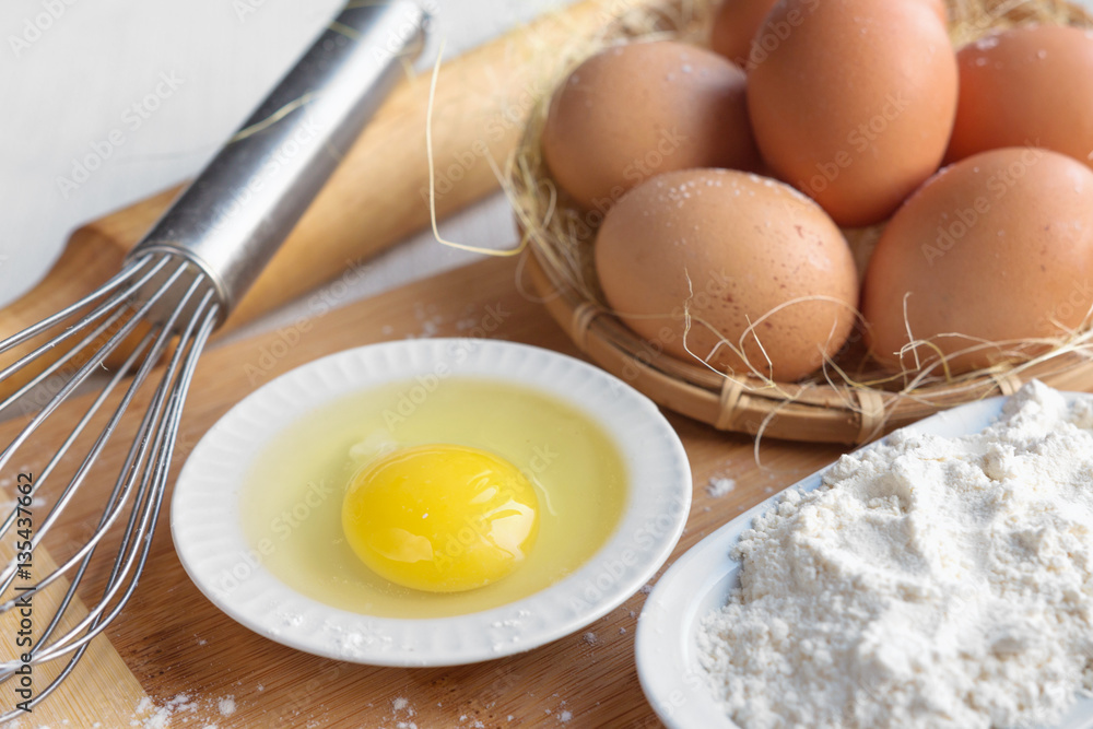 Eggs and flour ingredients like baking, culinary background Eggs and flour ingredients like baking, culinary background