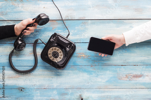 Old and new phone. Concept of technology progress
