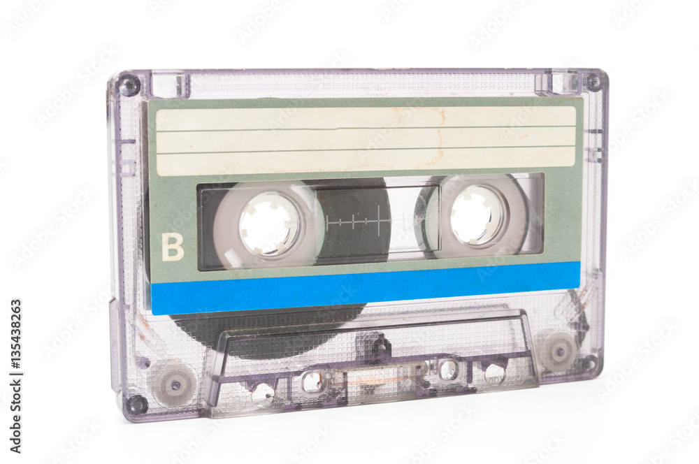 Fototapeta premium Used dust audio cassette on white background